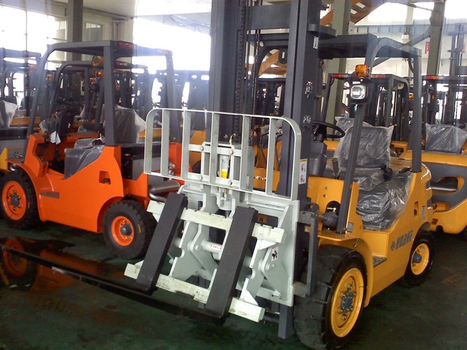 Forklift with hinged fork